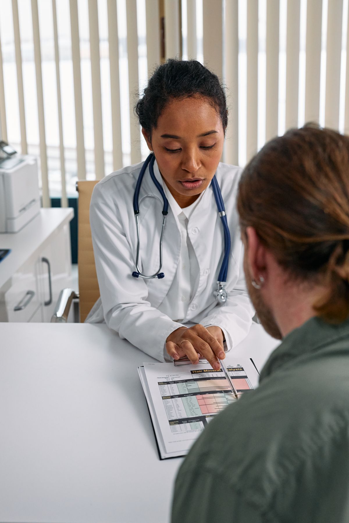 A licensed agent helping a patient understand health coverage